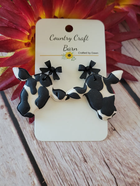 Holstein Sweethearts – Bow‑Tied Cow Country Craft Barn Earrings (E-099)