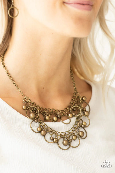 Warning Bells - Brass Paparazzi Necklace (PZ-2766)